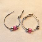 Silver Tone Hoop with a Two Silver and a Pink Bead Pierced Earrings (BD2) Silver Tone Hoop with a Two Silver and a Pink Bead Pierced Earrings (BD2)