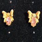 Gold Tone Bow with a Pink Stone Pierced Earrings (BD2) Gold Tone Bow with a Pink Stone Pierced Earrings (BD2)