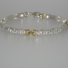"Dogwood" Sterling Silver And 18 Karat Yellow Gold Bracelet.