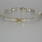 "Dogwood" Sterling Silver And 18 Karat Yellow Gold Bracelet.