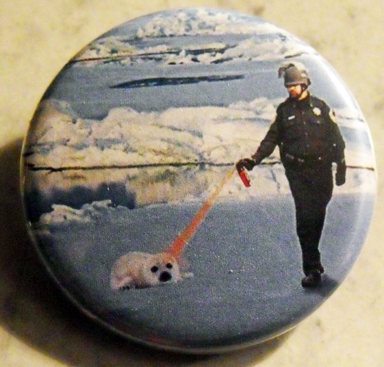 PEPPER SPRAY COP SPRAYS A SEAL pinback button badge 1.25"