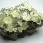 Shiny pyrite fossil mineral specimen with big gem crystals of clear calcite