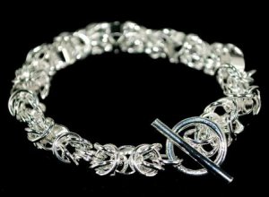 SB026&Acirc;&nbsp;STERLING SILVER PLATED RINGS CHARM BRACELET