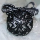 Unique handmade quilted black and silver ornament
