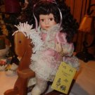 Porcelain Emerald Doll Collection Curly Black Hair Doll On Wooden Rocking Horse