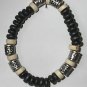 Black and white wood bead bracelet with silver accents
