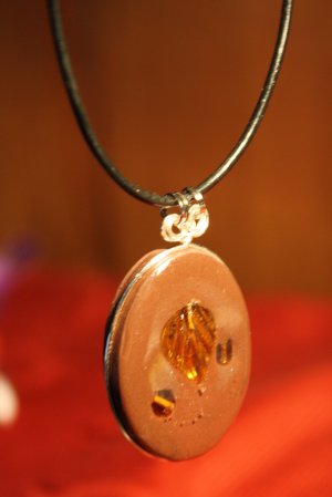 Brown Oval with Leaf