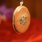 Brown Oval with a Flower