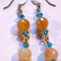 Orange and aquamarine artisan earrings dangle from surgical steel  earwires ID AA102