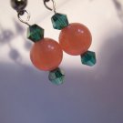 Salmon pink handcrafted jade earrings on surgical steel posts with teal green crystals ID GC-Psu188