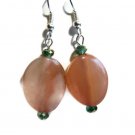 Hand crafted pink earrings oval twist with teal crystals on silver plated earwires