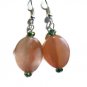 Hand crafted pink earrings oval twist with teal crystals on silver plated earwires