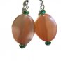 Hand crafted pink earrings oval twist with teal crystals on silver plated earwires