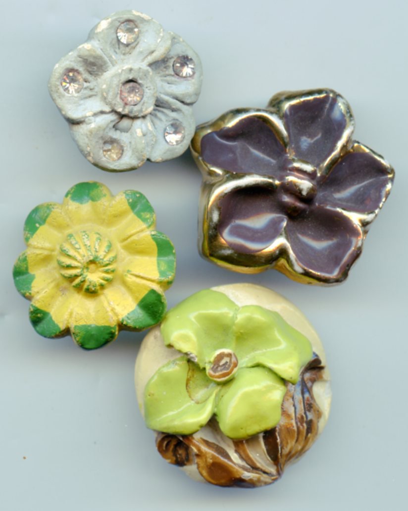 4 vintage plaster? buttons