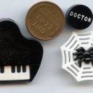Black/White plastic buttons piano spider in web and a verbal