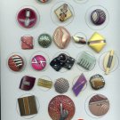 Card of celluloid buttons  largest size 1 7/8