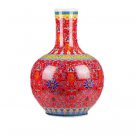 Red enamel celestial sphere shape ceramic vase on the ground Red enamel celestial sphere shape ceramic vase on the ground
