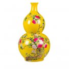 Yellow gourd shape ceramic vase with peach pattern on the ground