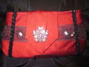 Solid Red Silk Tie Purse, black and silver trim and silver broach