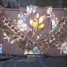 Brown floral Printed Tie Purse with brown lace and trime. Antique gold broach.