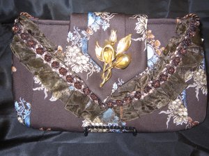 Brown floral Printed Tie Purse with brown lace and trime. Antique gold broach.