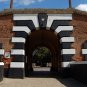 Sinister Terezin Concentration Camp Stone Entrance Gate Liberation Pin