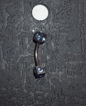 Light Blue eyebrow curve piercing 18G