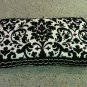 Black and White Damask with purple gems. New Mom must have!