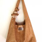 Serendipity leather bag with cuffs hand made in Bali by ELF.