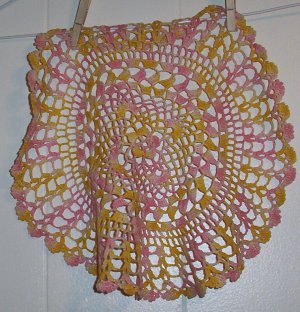 Pink and Yellow Crocheted Doily
