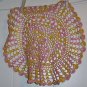 Pink and Yellow Crocheted Doily