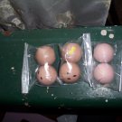 Six Small Wooden Doll Heads