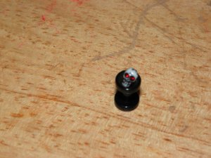 Black 8 Gauge Skull Plug Red Eyes 36