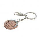 6 cm copper spinning key ring with blue rhinestones in Russian