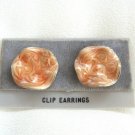 Swirl Dreamsicle Orange Salmon Clip On Earrings By Designer Avon Vintage 1970s