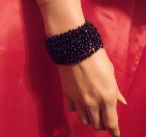 Beaded stretch with a buttoned closure