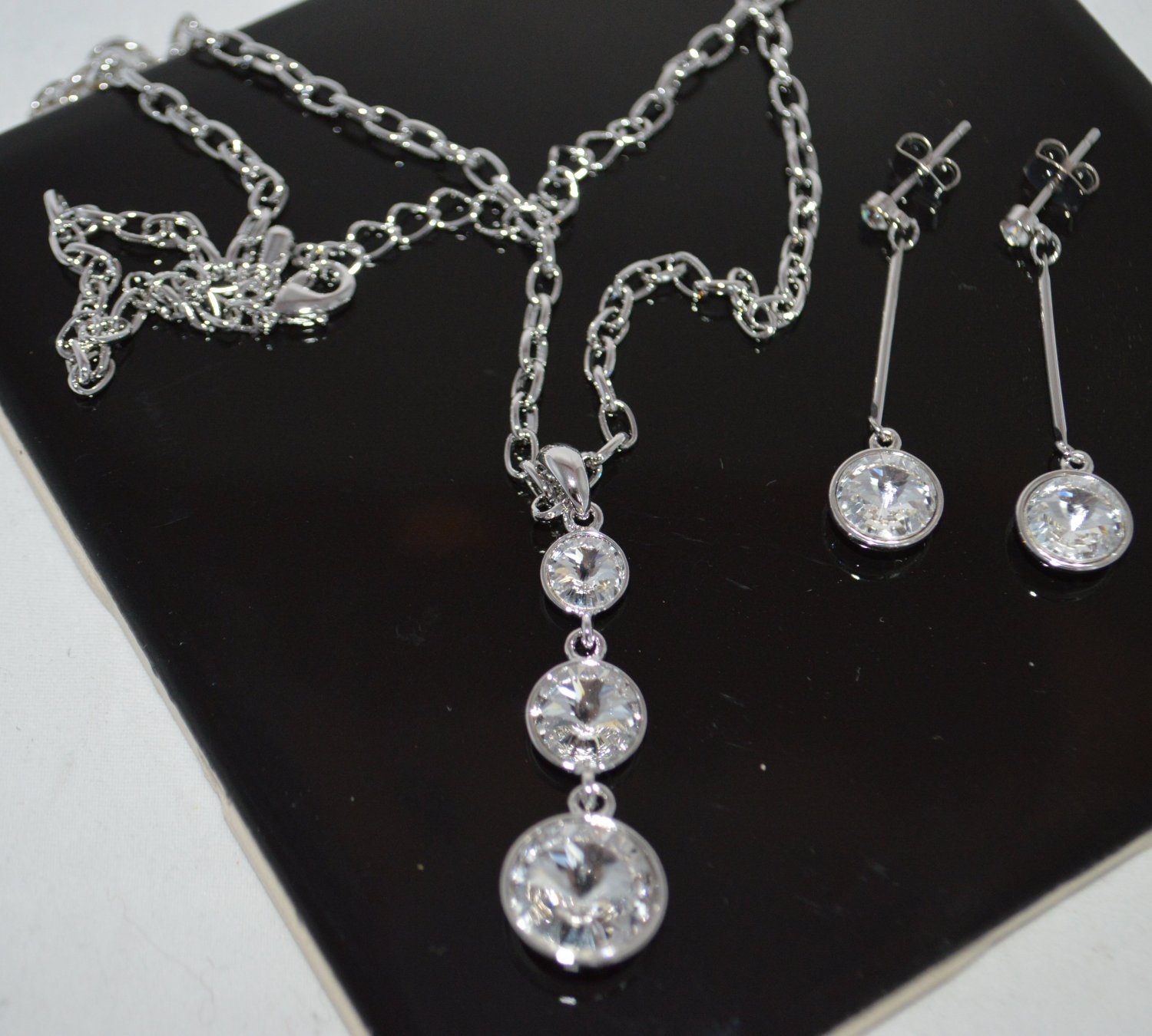 Clear Crystal Earring set Silver Tone Metal Dangle