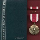 US Meritorious Service Military Award medal in case with ribbon bar and lapel pin