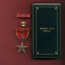 WWII Bronze Star medal in case with ribbon bar, lapel pin, Invasion money, stamps, etc.