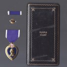 Purple Heart medal in WWII case with ribbon bar and lapel pin Purple Heart medal in WWII case with ribbon bar and lapel pin