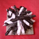 Black and white curly bow