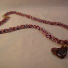 Red heart on spiral rope