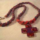 Red and purple cross on spiral rope