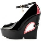 black patent leather with lovely eye pattern embellished high heel shoes