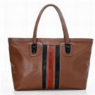 brown patent leather with black and red stripped canvas embellished handbag