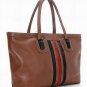 brown patent leather with black and red stripped canvas embellished handbag