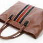 brown patent leather with black and red stripped canvas embellished handbag