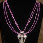 Item 112: 19" glass and rhinestone necklace with silvertone cross pendant