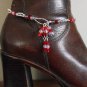 Item 74- 12" Boot bracelet of red, pink and clear glass.