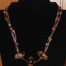 Item 120- 29.5" hessonite, ceramic, glass aventurine and tiger eye necklace